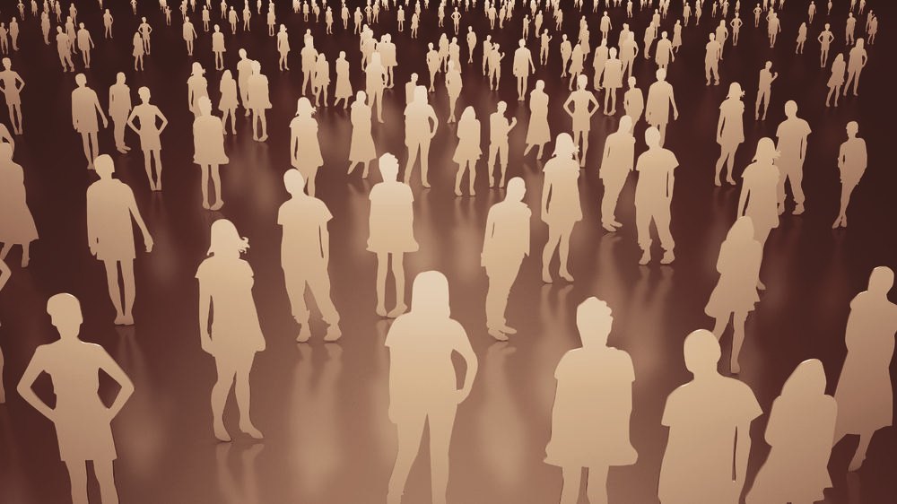 Viele Menschen stehen in einem Raum verteilt